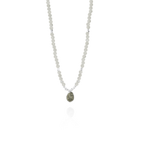 Elegant moonstone pendant with a silver setting and rough diamond accent.