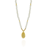 Elegant moonstone and gold hammered teardrop pendant with a timeless and sophisticated design.