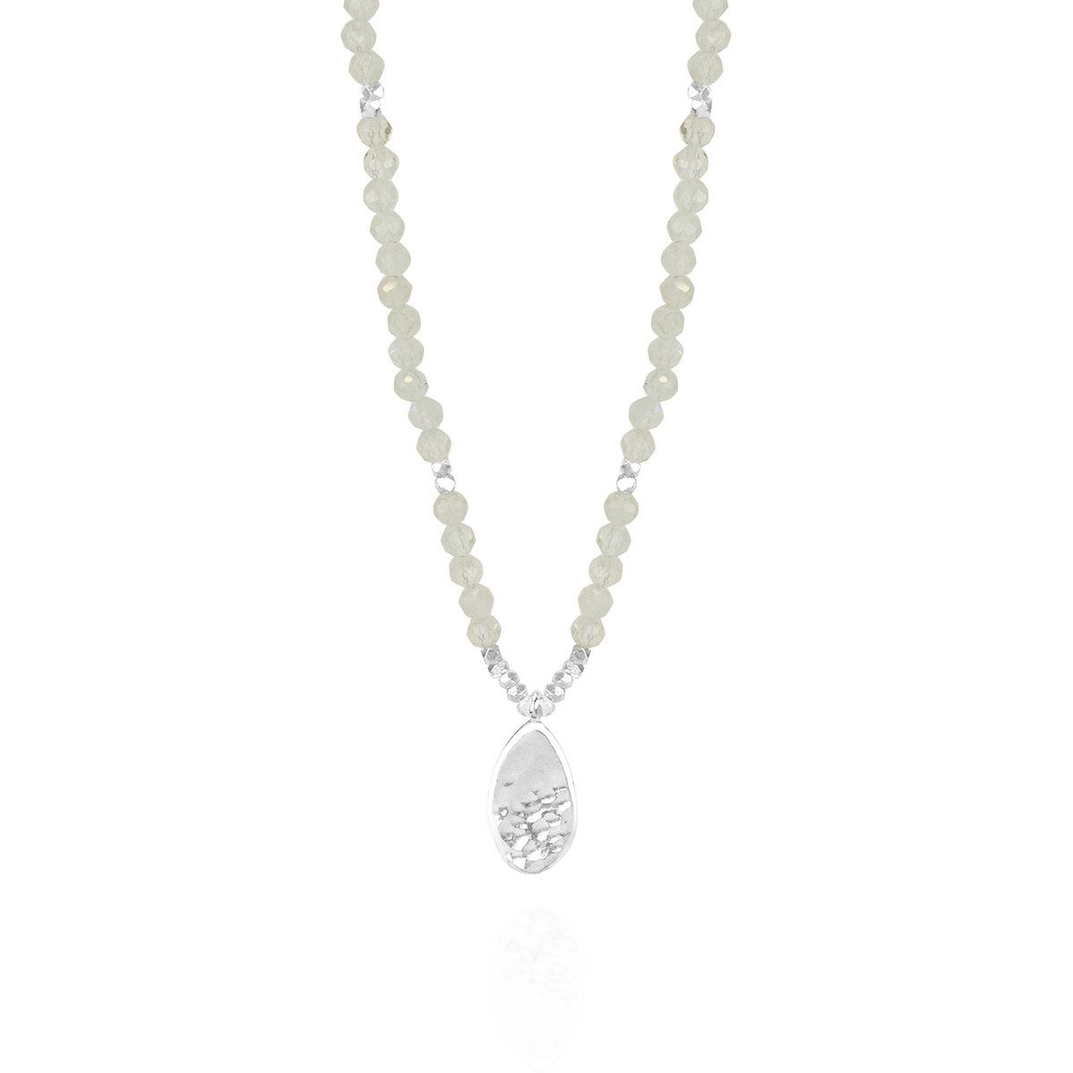 Elegant moonstone and silver hammered teardrop pendant with a timeless and sophisticated design.