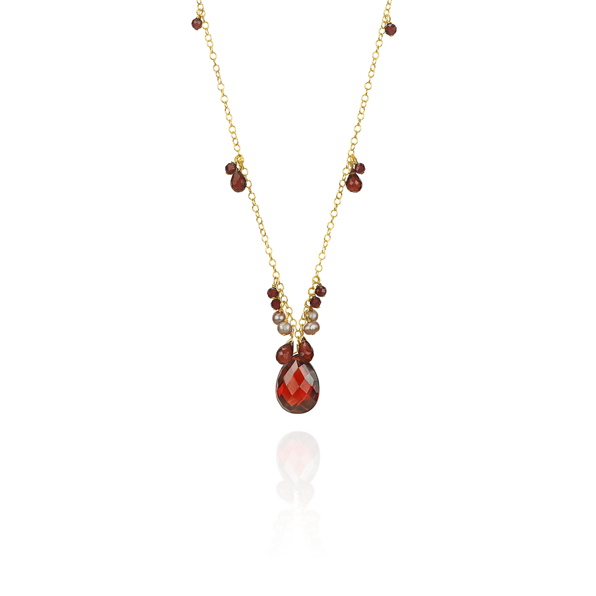 Stunning garnet, zircon, and pearl pendant showcasing vibrant gemstones in an elegant design.