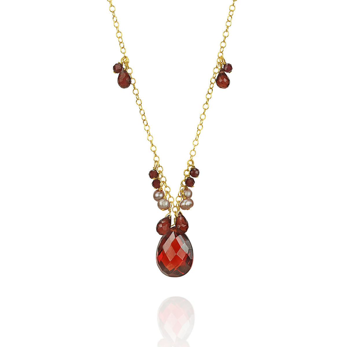 Stunning garnet, zircon, and pearl pendant, featuring a vibrant combination of gemstones in an elegant design.