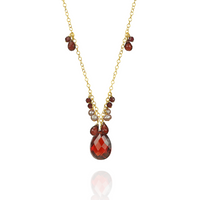 Stunning garnet, zircon, and pearl pendant, featuring a vibrant combination of gemstones in an elegant design.