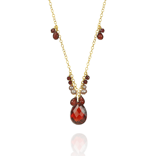 Stunning garnet, zircon, and pearl pendant, featuring a vibrant combination of gemstones in an elegant design.