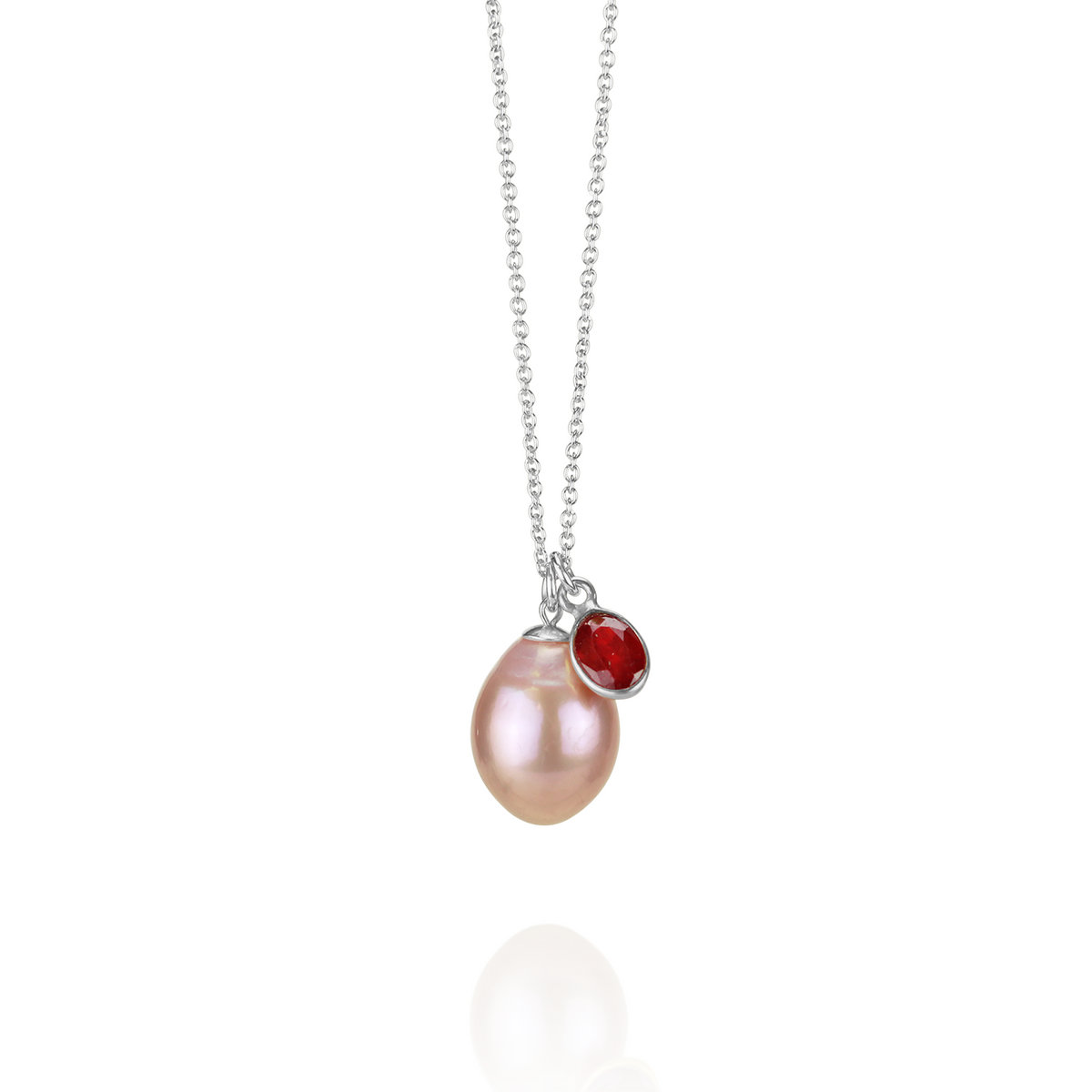 Elegant pink pearl and ruby pendant necklace set in gold, featuring a timeless and delicate design.