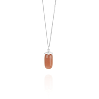 Smooth capsule pendant necklace, featuring a sleek and modern design that adds a minimalist touch to any outfit.