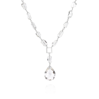 Elegant long necklace featuring tumbled rock crystal gemstones, perfect for adding a touch of sophistication to any outfit.