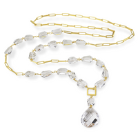 Long necklace with tumbled rock crystal gemstones, featuring an elegant minimalist design.