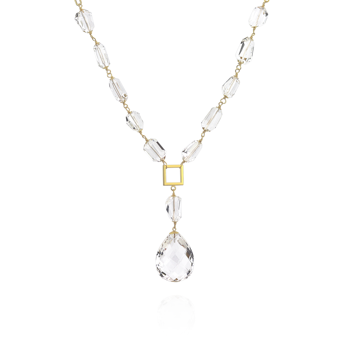 Long necklace with tumbled rock crystal gemstones, featuring an elegant minimalist design.